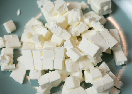 Feta cheese cubes in plateの写真素材