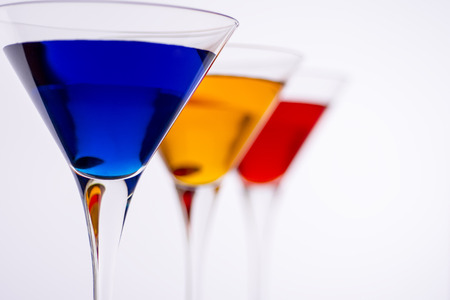 Colorful Cocktails in Martini Glasses Background. Bar Commercials Concept.の写真素材