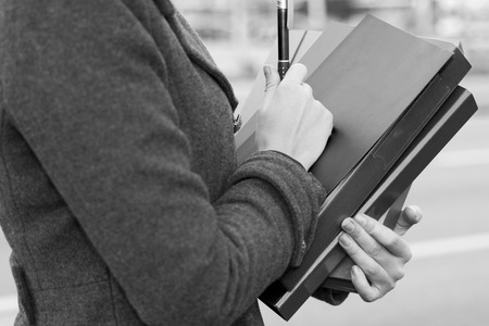 Young Business Woman Hands Holding Folders on the Streetの写真素材