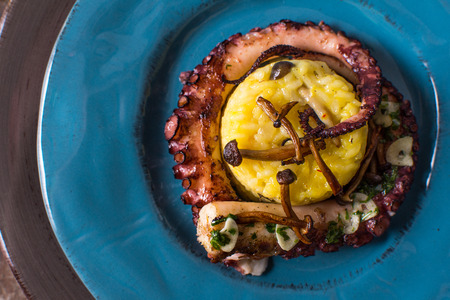 Grilled Seafood Octopus on Saffron Risotto with Brown Shimeji Mushroomsの写真素材