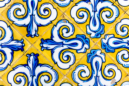 Colorful Vintage Style Ceramic Tile Pattern Texture and Background. Yellow, Blue and White Tiles for Floors and Walls.の写真素材