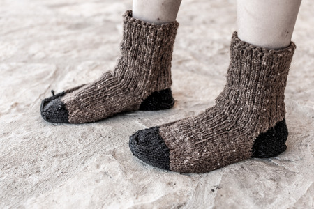 Boy in Traditional Handmade Knitted Wool Socksの写真素材