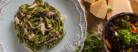 Green Spinach Pasta Tagliatelle with Bacon, Brown Shimeji Mushrooms and Parmesan Cheeseの写真素材