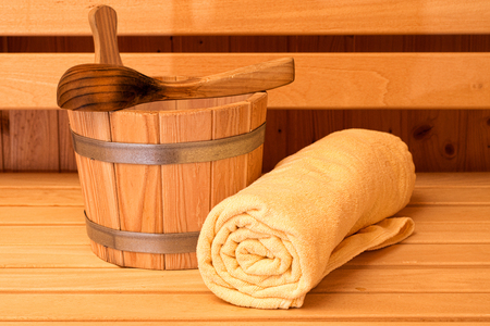 Detail of Bucket and Yellow Towels in a Saunaの写真素材