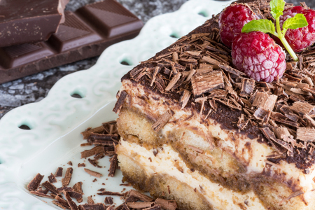 Tiramisu Cake with Grated Chocolate, Raspberry and Mint. Perfect Dessert.