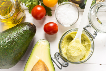 Homemade Avocado Spread Guacamole in Glass Jar. Vegan Raw and Healthy Food.の写真素材