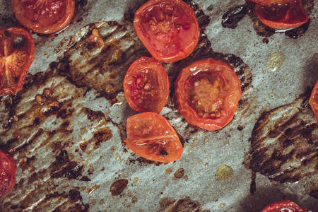 Roasted Cherry Tomatoes on Parchment. Rustic Style.の写真素材