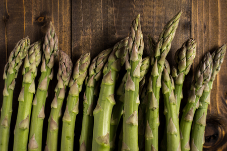 Fresh Green Asparagus on Dark Wooden Background. Copy Space.の写真素材