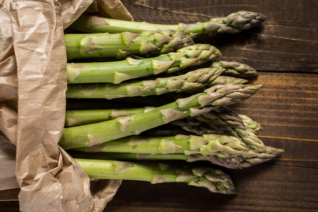 Green Asparagus on Wooden Background with Copy Spaceの写真素材