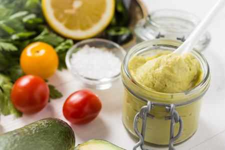 Vegan Raw and Healthy Food Concept. Homemade Avocado Spread Guacamole in Jar.の写真素材