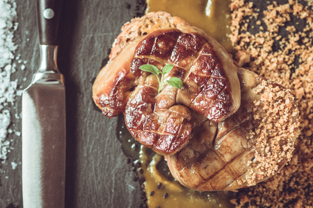French Cuisine Fried Foie Gras with Mango Puree on Dark Backgroundの写真素材