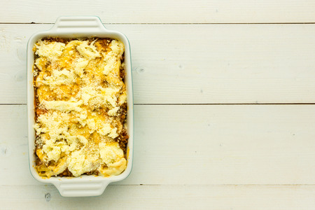 Making Lasagna Bolognese with Beef, Bolognese Sauce and Basil. Ready for Baking.の写真素材