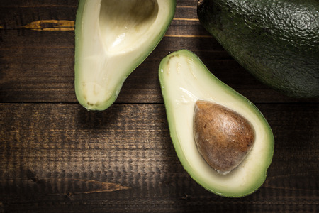 Avocado on Dark Wooden Background