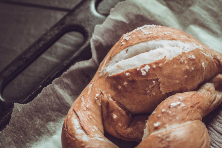 Fresh Rustic Pretzels From the Oven on Baking Sheetの写真素材