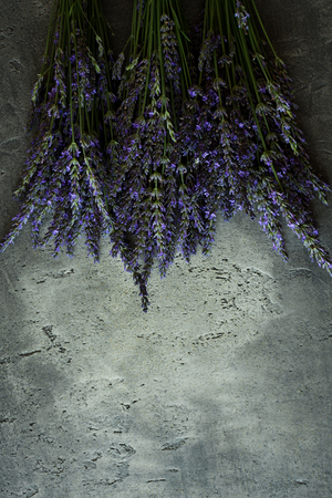 Lavender Vintage Flowers Bouquet on Rustic Dark Backgroundの写真素材