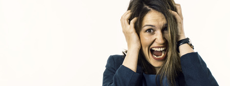 Screaming Woman is Going Crazy Pulling Her Hair. Stress Concept.
