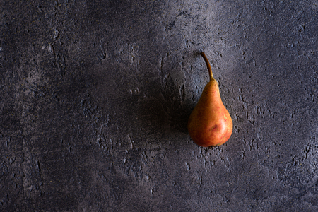 Organic Pear on Rustic Dark Background with Copy Space. Health Benefits.の写真素材