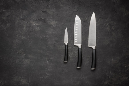 Set of Kitchen Knives on Stone Backgroundの写真素材