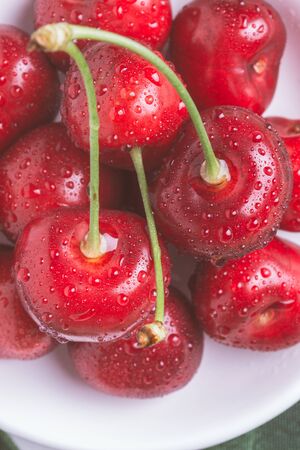 Fresh Organic Cherries with Water Drops as Healthy Food Concept