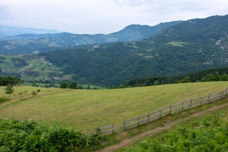Mountain Landscape and Green Meadow with Blue Cloudy Sky. National Park Tara.の写真素材