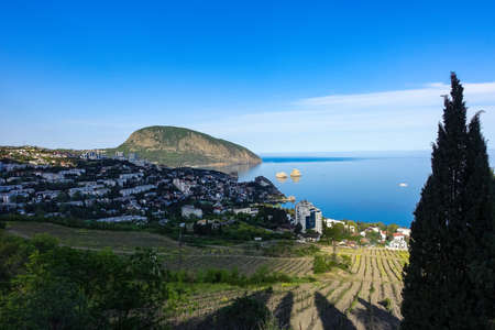 View of the Ayu-Dag mountain and the city of Gurzuf from the observation deck. Crimean Mountains. May. 2021. Crimea. Russia. The Crimean Peninsula.の写真素材