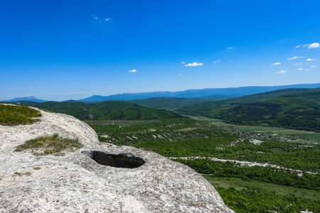 View of the picturesque Crimean mountains from the cave town of Tepe-Kermen in summer. May. 2021. Crimea.の写真素材