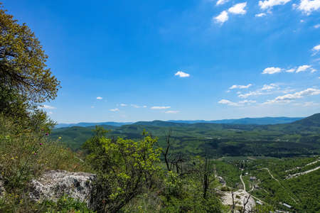 View of the picturesque Crimean mountains from the cave town of Tepe-Kermen in summer. May. 2021. Crimea.の写真素材