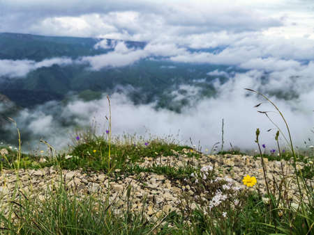 The Bermamyt Plateau and the rocks of two monks in a cloud, Caucasus, Russia 2021.