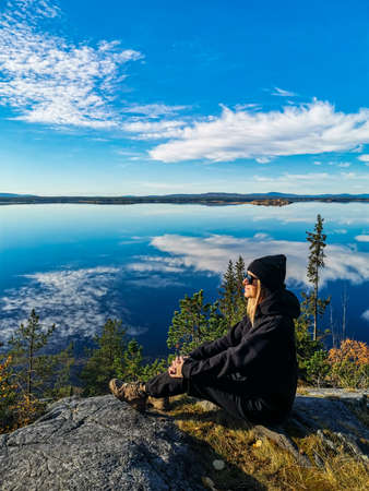 A girl on the White Sea coast on a sunny day. Karelia. Russia. 2021の写真素材