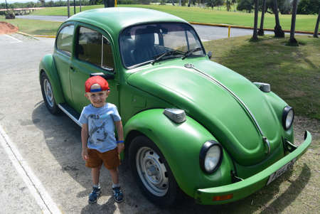 Varadero, Cuba - March 30, 2019: Cuban boy, vintage carのeditorial素材