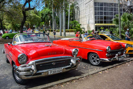 havana. Cuba - March 27, 2019 : street scene with old cars and colorful buildings in Old Havana