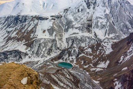 Caucasian mountain in summer. Cross pass in Georgia. View from the monument Arch of Friendship of peoples on the lake.の写真素材