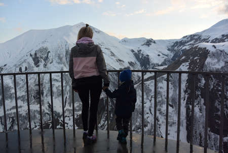 A girl and a boy on the background of a canyon. Friendship arch is an observation point in Georgia on the Military highway.の写真素材