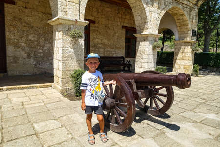 A boy on the territory of the Naryn-Kala Fortress in Derbent. Dagestan, RussiaJune 2021のeditorial素材