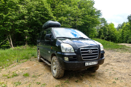 The car is in the zhivoisny forest in the Krasnodar Territory, near Mezmai. Russia 2021.のeditorial素材