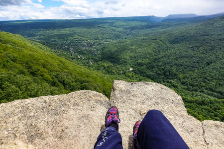 A girl on the background of the landscape of the Caucasus Mountains - The Eagle Rocks Mountain shelf, Mezmai 2021の写真素材