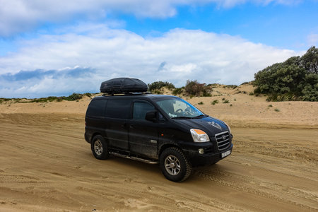 Car in the dunes on the Black Sea coast. Vityazevo. Russia 2021.のeditorial素材