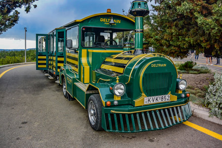 Attractions and entertainment in Mtatsminda Park. green steam locomotive. Tbilisi Georgia. April 28, 2019のeditorial素材