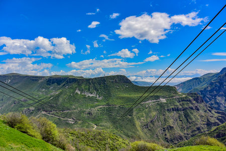 A girl with a child near the Tatev Monastery. 8th century, an ancient monastery located in Armenia , Syunik region, Tatev village. May 5, 2019の写真素材