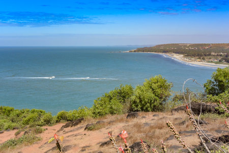 Panoramic view of beautiful blue Arabian Sea and a lush adjacent hill from the top of Chapora Fort, Goa Indiaの写真素材