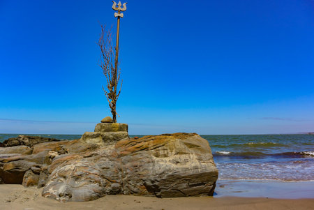 Shiva's face and Trident totem on Vagator beach, Goa, India. The northernmost beach of Bardez Taluka in Goa. March 2020.の写真素材