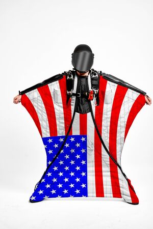 USA extreme. Flag in skydiving. People in free fall grab flag of USA. Patriotism, men and flag.の写真素材