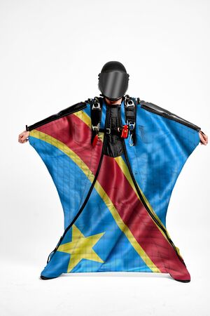 Democratic Republic of the Congo extreme. Flag in skydiving. People in free fall grab flag of Democratic Republic of the Congo. Patriotism, men and flag.の写真素材