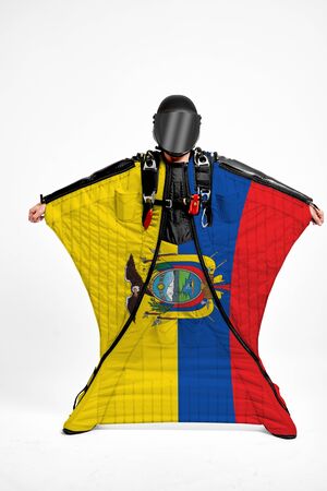 Ecuador extreme. Flag in skydiving. People in free fall grab flag of Ecuador. Patriotism, men and flag.の写真素材
