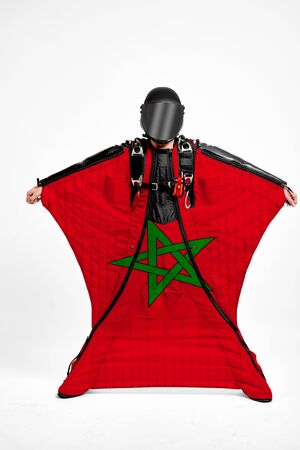 Morocco extreme. Flag in skydiving. People in free fall grab flag of Morocco. Patriotism, men and flag.の写真素材