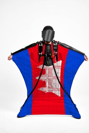 Cambodia extreme. Flag in skydiving. People in free fall grab flag of Cambodia. Patriotism, men and flag.の写真素材