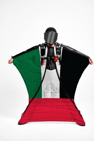United Arab Emirates extreme. Men in wing suit templet. Skydiving men in parashute. Simulator of free fall.の写真素材