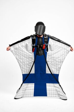 Finland extreme. Men in wing suit templet. Skydiving men in parashute. Simulator of free fall.の写真素材
