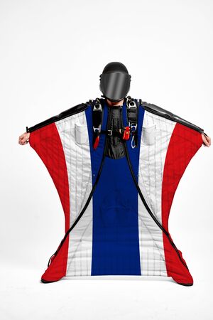 Thailand extreme. Men in wing suit templet. Skydiving men in parashute. Simulator of free fall.の写真素材