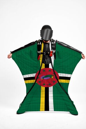 Dominica extreme. Men in wing suit templet. Skydiving men in parashute. Simulator of free fall.の写真素材